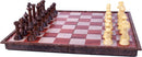 A wooden magnetic chess set featuring an 11-inch foldable board. The board showcases alternating squares in classic red and light wood colors. On one side, there are intricately carved dark wood chess pieces, and on the opposite side, light yellow pieces. The magnetic feature ensures secure piece placement during play.