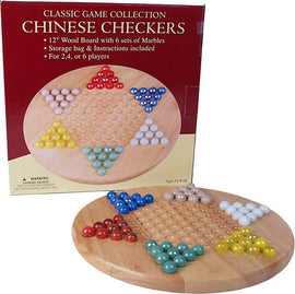 A 12-inch Chinese Checkers game featuring a wooden board with six sets of colorful marbles. The board is displayed with marbles arranged in triangular formations. The game box is visible in the background, indicating it's suitable for 2 to 6 players and includes storage for the marbles along with instructions.