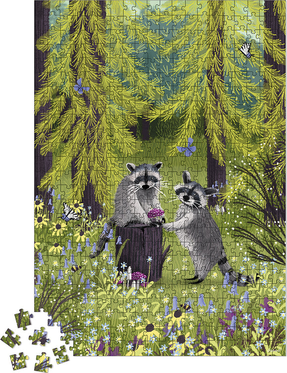 A colorful jigsaw puzzle featuring two playful raccoons amidst lush green trees and vibrant wildflowers. One raccoon is perched on a stump, while the other holds a berry. The puzzle pieces scatter around the base, showcasing the vivid forest scene.