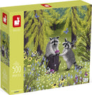 Colorful jigsaw puzzle box featuring two adorable raccoons sharing a mushroom in a vibrant forest setting filled with flowers and butterflies. This 500-piece puzzle is made by Janod.
