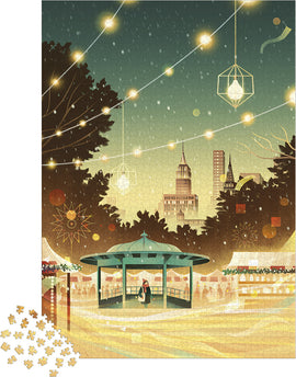 A vibrant jigsaw puzzle depicting a serene scene of New York City at dusk. Features a beautifully illuminated gazebo in a park with city skyscrapers in the background, twinkling lights strung overhead, and festive decorations, inviting a sense of warmth and nostalgia. Puzzle pieces scattered nearby.
