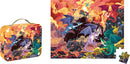 A colorful jigsaw puzzle titled 'Fiery Dragons' by Janod, featuring vibrant illustrations of various dragons soaring above rocky mountains and treasure. The illustration showcases detailed dragons in different colors against a dramatic backdrop of orange and red skies, with the puzzle pieces in a tote box designed for children aged 5 and up.