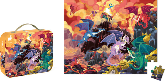 A colorful jigsaw puzzle titled 'Fiery Dragons' by Janod, featuring vibrant illustrations of various dragons soaring above rocky mountains and treasure. The illustration showcases detailed dragons in different colors against a dramatic backdrop of orange and red skies, with the puzzle pieces in a tote box designed for children aged 5 and up.