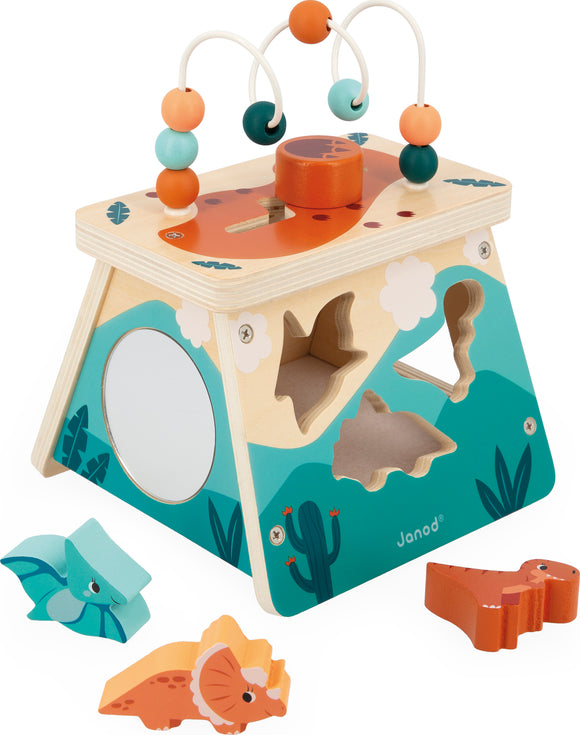 A colorful wooden activity center designed for children, featuring a vibrant volcano top with a sliding shape sorter, rounded beads on a wire for hand-eye coordination, and various animal-shaped blocks including a dinosaur and a bat. The sides are decorated with playful designs like clouds and cacti, enhancing its engaging look.