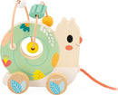 The Pure Animal Baby Looping Asst by Janod features a charming snail design with a colorful looping bead maze. It has a green spiral body decorated with floral patterns, and a smiling face. The toy includes wooden wheels and a pull string for interactive play, making it an engaging and educational toy for toddlers.