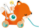 The Pure Animal Baby Looping Asst by Janod is a colorful wooden toy designed for young children. It features a charming fox design with vibrant orange colors and cheerful facial expression. The toy includes colorful beads threaded onto flexible wires, allowing for engaging play and fine motor skill development. The fox has smooth, rounded wheels, making it easy for little hands to pull along during playtime.