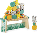 Tropik Balancing Games by Juratoys featuring colorful wooden animal and fruit-shaped blocks stacked on a balancing base. The game promotes coordination and creativity with its vibrant pieces, suitable for young children.