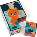 A colorful wooden jigsaw puzzle set by Juratoys featuring six animal blocks. The blocks show vibrant illustrations of various cute animals, including a cheerful orange bear. They are designed with engaging colors and shapes that invite children to play and learn. The blocks are stacked together, displaying different pieces of the playful animal theme.