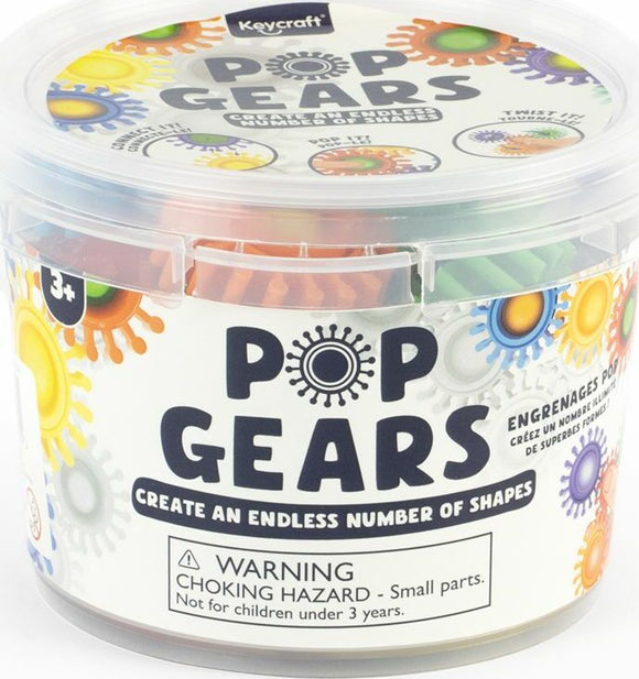 A clear plastic container labeled 'Pop Gears' featuring colorful interlocking gear pieces. The container showcases the vibrant colors of the gears, which can be assembled into various shapes. The label indicates that the product includes 21 pieces and is suitable for ages 3 and up. A warning about small parts is visible.
