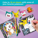 A hand coloring Pokémon themed art sheets with a vibrant design. The image features Snorlax, Pikachu, Slowpoke, and Charmander cutouts displaying colorful faces. There are various colored pens scattered around alongside completed Pokémon art, such as a stained-glass style Cubone. The set includes 18 art sheets for coloring and creative fun.