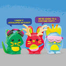 Three colorful wax animal figures: a green cat with pink headphones, a red rabbit with antlers, and a blue bunny wearing a crown and a mask. They are posed with playful expressions and speech bubbles saying humorous phrases.