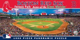 MasterPieces Red Sox Fenway Park panoramic jigsaw puzzle showcasing a vibrant scene of the iconic baseball park filled with enthusiastic fans. Features the famous Green Monster outfield wall, the baseball diamond, and a clear sky as the backdrop. Contains 1000 pieces for a challenging and enjoyable puzzle experience.