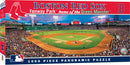 A 1000-piece jigsaw puzzle depicting a panoramic view of Fenway Park, home of the Boston Red Sox. The image features a bustling baseball game with players in action, vibrant crowd scenes, and the iconic Green Monster wall in the background.