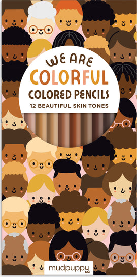 We Are Colorful Pencil Set by Mudpuppy featuring 12 colored pencils representing a variety of skin tones. The packaging showcases diverse cartoon faces and artistic design, perfect for creative projects.