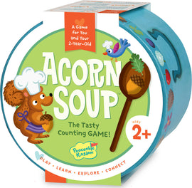 Acorn Soup game by Peaceable Kingdom featuring a cheerful squirrel chef holding an acorn. The packaging is vibrant with playful illustrations including a bird and various colorful ingredients. It promotes counting and is suitable for children aged 2 and up, emphasizing play, learning, exploration, and connection.