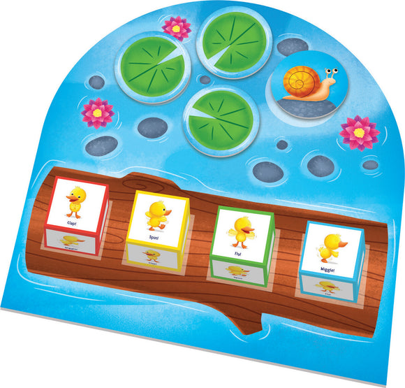 Colorful board game DUCK DUCK DANCE! by Peaceable Kingdom. Features a lily pad theme with four action cubes (Clap!, Spin!, Fly!, Wiggle!) on a wooden dock. Ideal for engaging kids in interactive play.