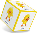 A colorful, interactive game cube titled 'DUCK DUCK DANCE!' by Peaceable Kingdom, featuring cheerful cartoon ducks performing various playful actions like jumping, wiggling, and twisting on its sides. Each face of the cube encourages motion, making it perfect for engaging young children in fun, active play.