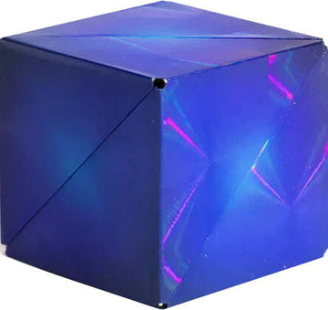 Shashibo HG: Vapor, a mechanical puzzle designed by Geobenders, features a sleek, iridescent blue exterior that changes colors with light. The cube shape allows for endless transformations and engaging tactile play, making it perfect for puzzle enthusiasts.