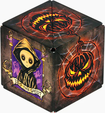 Shashibo: JACK O LANTERN by Geobenders is a mechanical puzzle featuring a spooky design with a ghostly figure and a haunting jack-o'-lantern. The puzzle displays intricate artwork on its surfaces and offers a challenge for puzzle enthusiasts.