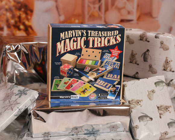 Marvin's Treasured Magic Tricks Wooden Set by Marvin's Magic, featuring various magic props such as a wooden block escape, a mind-reading dice trick, amazing racing cards, and a magic wand. The colorful box showcases engaging illustrations and emphasizes it as a complete magic show kit, ideal for aspiring magicians.
