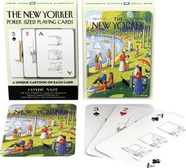 Fine Arts Cartoon Cards from New York Puzzle Company featuring unique New Yorker magazine illustrations. The deck showcases poker-sized cards with distinct cartoons, including a scenic outdoor gathering and playful humor in each card's design.