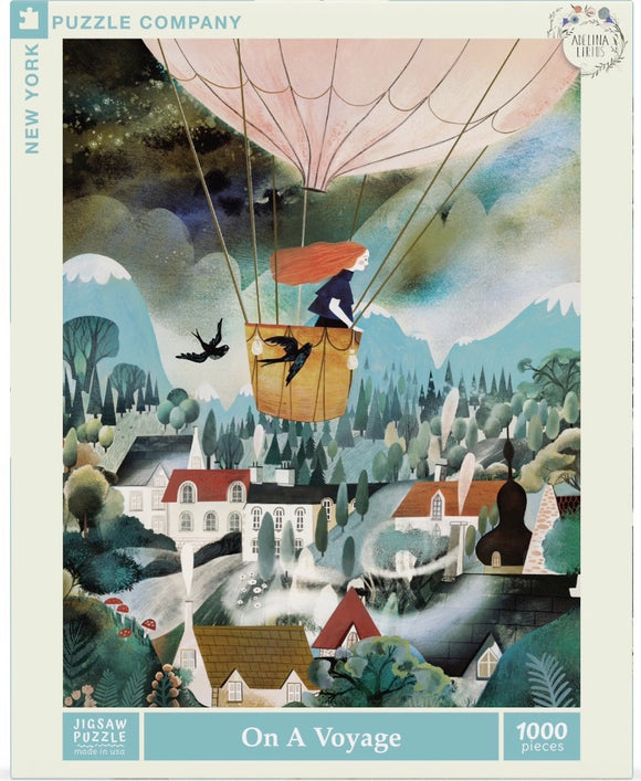 A beautifully illustrated jigsaw puzzle titled 'On a Voyage' by New York Puzzle Company featuring a girl in a hot air balloon surrounded by scenic landscapes. The vibrant colors and whimsical design depict mountains, forests, and charming houses, inviting puzzlers to embark on a captivating journey.