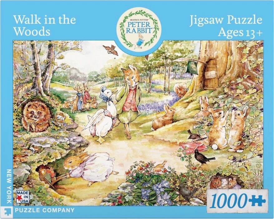 Box cover of the 'Walk in the Woods' jigsaw puzzle by New York Puzzle Company. Features a colorful illustration of forest animals, including rabbits, hedgehogs, and a duck, in a whimsical woodland setting. The puzzle contains 1000 pieces and is suitable for ages 13 and older.