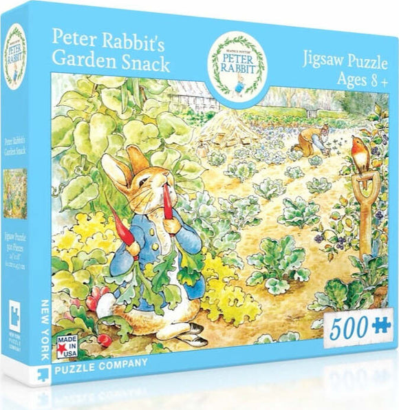 A colorful jigsaw puzzle box featuring Peter Rabbit in a lush garden, holding carrots with green leaves. The scene includes other rabbits and blooming vegetables, inviting users to immerse themselves in a delightful garden adventure. Designed for ages 8 and up, this puzzle contains 500 pieces and is made in the USA.