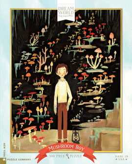 The 'Mushroom Boy' jigsaw puzzle features an illustrated scene of a young boy standing amidst a vibrant collection of mushrooms in various colors. The background is dark, highlighting the colorful fungi, creating a whimsical atmosphere. The puzzle contains 500 pieces and is made by the New York Puzzle Company.