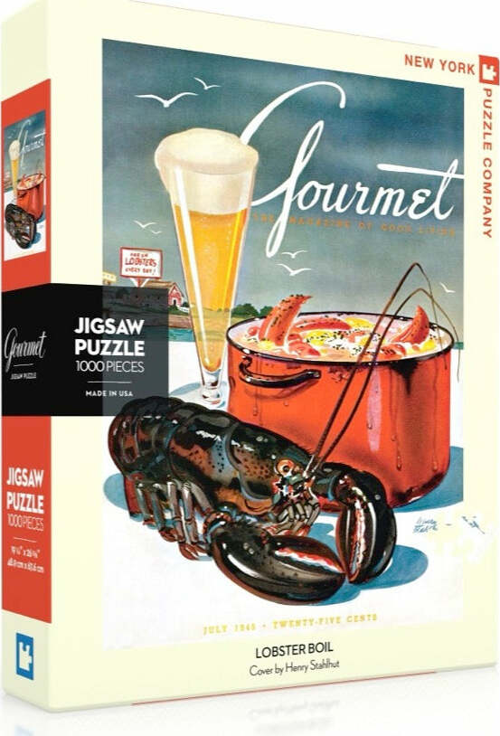 A jigsaw puzzle box featuring the 'Lobster Boil' design by New York Puzzle Company. The artwork displays a vibrant illustration of a lobster and a pot, with a glass of beer in the background. The puzzle consists of 1000 pieces and is ideal for seafood lovers and puzzle enthusiasts.