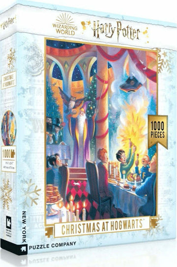 A colorful jigsaw puzzle box titled 'Christmas at Hogwarts' featuring festive scenes from the Harry Potter universe. It showcases Hogwarts during a Christmas banquet, with characters celebrating around a lavishly set table. The box highlights that it's a 1000-piece puzzle made by New York Puzzle Company.