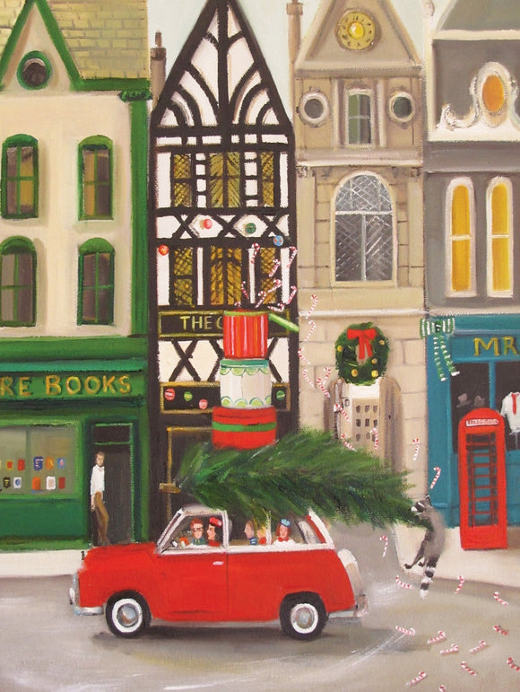 A cheerful jigsaw puzzle titled 'Christmas Cheer' by New York Puzzle Company, depicting a festive street scene. In the foreground, a bright red car carries a freshly cut Christmas tree atop its roof. The background features charming storefronts decorated for the holidays, with wreaths, candy canes, and colorful lights, creating a joyful and nostalgic holiday atmosphere.