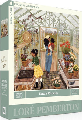 The puzzle box for 'Dawn Chorus', a 500-piece jigsaw by New York Puzzle Company, featuring a charming illustration by Loré Pemberton. The image depicts a cozy greenhouse scene with two children watering plants, surrounded by vibrant flowers in pots and gardening tools. Sunlight filters through the glass panels, creating a warm and inviting atmosphere.