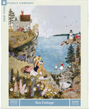 The Sea Cottage jigsaw puzzle by New York Puzzle Company features a serene coastal scene with a charming cottage, a woman relaxing by the shore, children playing, a sailboat on the water, and colorful flowers in the foreground. This 1000-piece puzzle captures the beauty of seaside life and invites puzzle enthusiasts to enjoy a delightful and engaging experience.