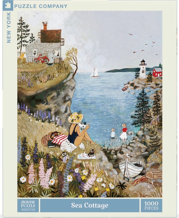 The Sea Cottage jigsaw puzzle by New York Puzzle Company features a serene coastal scene with a charming cottage, a woman relaxing by the shore, children playing, a sailboat on the water, and colorful flowers in the foreground. This 1000-piece puzzle captures the beauty of seaside life and invites puzzle enthusiasts to enjoy a delightful and engaging experience.