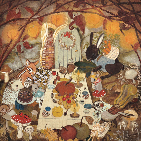 A whimsical jigsaw puzzle image featuring woodland animals gathered around a table filled with autumnal foods and decorations. The scene showcases a rabbit, squirrel, hedgehog, and bird, celebrating in a cozy setting surrounded by pumpkins, acorns, and foliage. The intricate details of each character and the vibrant colors create a cheerful and inviting atmosphere, perfect for puzzle enthusiasts and nature lovers alike.