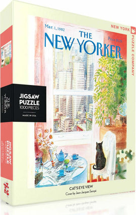 A beautifully illustrated jigsaw puzzle titled 'Cat's Eye View' by New York Puzzle Company, featuring a cozy interior with a cat sitting by a window, revealing a scenic cityscape. The puzzle contains 1000 pieces and showcases a cover art by Jean-Jacques Sempé, reminiscent of a vintage New Yorker magazine. Perfect for puzzle enthusiasts and cat lovers alike, the packaging highlights the charming details of the artwork.
