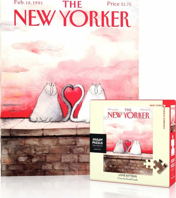 A colorful packaging of the Love Kittens Mini Puzzle by New York Puzzle Company featuring an illustration of two cartoon cats sitting on a wall, forming a heart with their tails. The background is a gradient of pink hues, reminiscent of a sunset. The box displays the title 'Love Kittens' and includes details like 'Jigsaw Puzzle 500 Pieces' and the date from a New Yorker magazine cover.