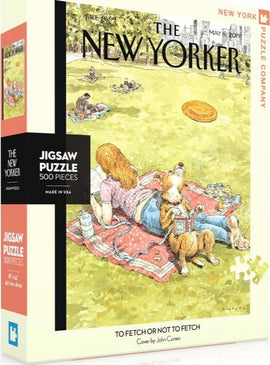 To Fetch or Not To Fetch jigsaw puzzle by New York Puzzle Company. The puzzle features an illustration from The New Yorker magazine, depicting a relaxing scene in a park with people and a dog. The box measures approximately 8 inches by 10 inches and contains 500 pieces.