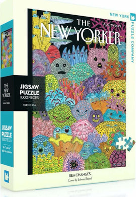 The 'Sea Changes' jigsaw puzzle by New York Puzzle Company features a vibrant and whimsical underwater scene with colorful sea creatures and corals, designed by Edward Steed. It contains 1000 interlocking pieces and is suitable for puzzle enthusiasts of all ages.