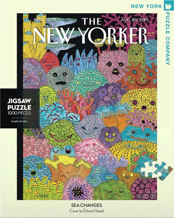 A vibrant jigsaw puzzle titled 'Sea Changes' by New York Puzzle Company featuring a colorful underwater scene full of whimsical sea creatures and corals, designed by Edward Steed. The puzzle contains 1000 pieces and is packaged in a box showcasing the intricate artwork.
