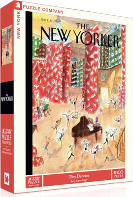 The 'Tiny Dancers' jigsaw puzzle by New York Puzzle Company features a colorful illustration of a lively dance scene in an art studio. The artwork, created by Jean-Jacques Sempé, depicts numerous small dancers joyfully performing amidst vibrant red curtains and a bustling background, capturing a spirited atmosphere in a playful setting.