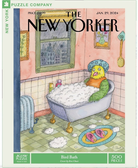 A whimsical jigsaw puzzle titled 'Bird Bath' featuring a colorful cartoon illustration by Roz Chast. The scene shows a bird character lounging in a bubble-filled bathtub, surrounded by soap bubbles and playful decor in a bathroom setting. It highlights vibrant colors and humorous details, inviting puzzlers to enjoy a fun and creative experience.