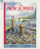 A colorful jigsaw puzzle box titled 'Tourist Season' featuring a whimsical illustration by Peter de Seve. The scene depicts a group of cheerful bluebirds wearing various hats, standing on a wooden dock by the water, with a boat in the background. This 1000-piece puzzle showcases a playful and vibrant interpretation of nature.