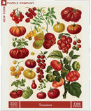 A vibrant jigsaw puzzle featuring an assortment of illustrated tomatoes in different shapes, sizes, and colors on a cream background. The puzzle contains 500 pieces and is produced by New York Puzzle Company.