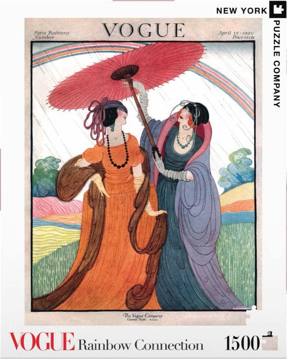 A vibrant jigsaw puzzle titled 'Rainbow Connection' by New York Puzzle Company, featuring an illustration from a 1920 Vogue magazine cover. The artwork depicts two elegantly dressed women sharing an umbrella under a colorful, arching rainbow with artistic backgrounds of hills and flowing lines.