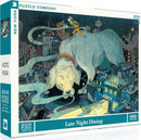 A jigsaw puzzle titled 'Late Night Dining' by New York Puzzle Company. The artwork features a large dog in an urban setting, with a person in yellow attire interacting humorously with the scene. The puzzle consists of 1000 pieces.