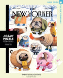 A vibrant jigsaw puzzle titled 'Baby It's Cold Outside' by New York Puzzle Company, featuring whimsical illustrations of dogs dressed in winter attire, playing in the snow. The puzzle contains 1000 pieces and showcases charming, colorful artwork by Ana Juan. The box has a sleek design and highlights the New Yorker logo.
