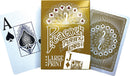 A pack of Large Print Playing Cards by Outset Media, featuring an ornate gold box design with peacock imagery and intricate patterns. Displayed are two cards, including an Ace of Spades and a Jack of Diamonds, showcasing their large print for enhanced visibility.