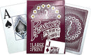 A boxed set of large print playing cards by Outset Media featuring a decorative peacock design. The pack showcases the Ace of Spades and a Jack card, emphasizing its large, easy-to-read print for enhanced visibility and accessibility.